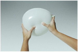 Squeeze too much on one side, and the air has to go somewhere else.